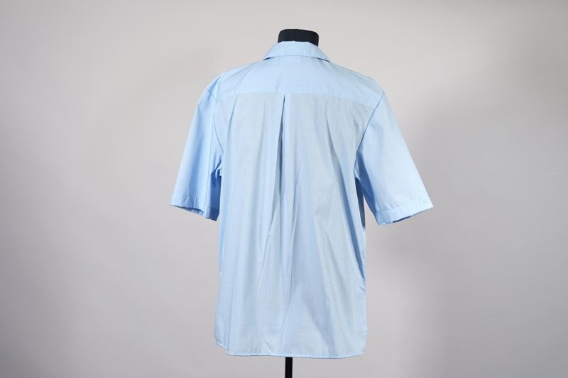 Unternehmensbekleidung, Bluse für Schaltermitarbeiterin der Deutschen Post AG